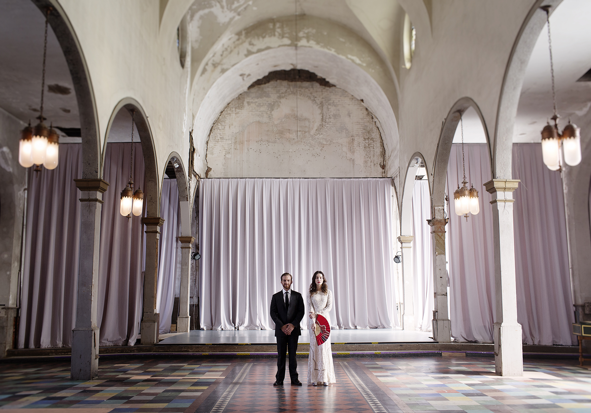 Newlywed couple's portrait in The Marigny Opera House, an eclectic New Orleans wedding venue